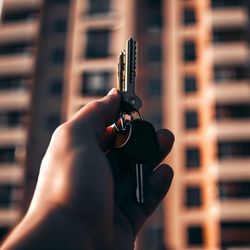 Close-up of hand holding key