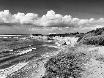 Scenic view of sea against cloudy sky