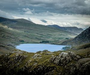 Scenic view of lake and mountains against sky