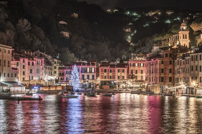 Illuminated buildings in city at night