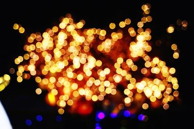 Close-up of illuminated christmas lights at night