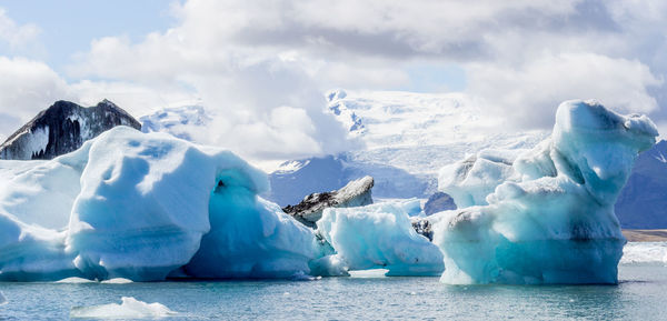 Panoramic view of frozen sea against sky