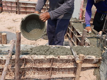 Low section of man working at construction site