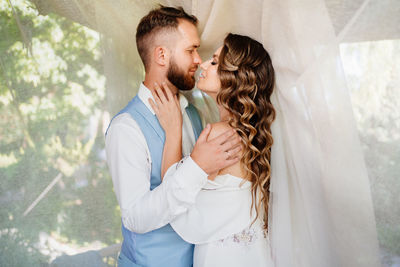 Side view of smiling young couple