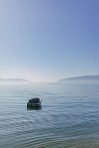 Boat in sea against clear sky