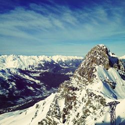 Scenic view of snow covered mountains against sky