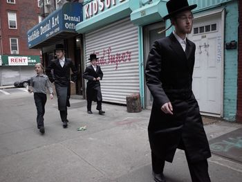 Full length of man standing in front of building