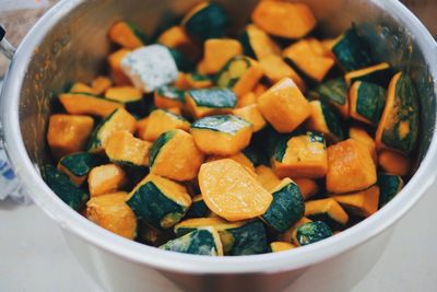 High angle view of chopped pumpkin in bowl