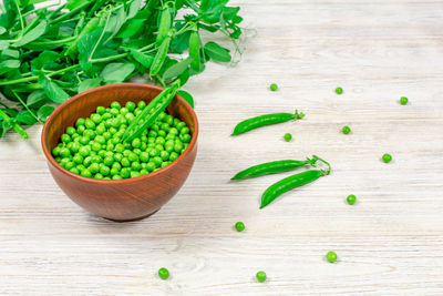 High angle view of green peas on table
