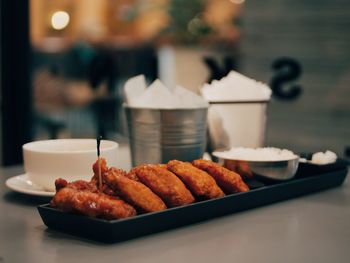 Close-up of serving food in plate on table in restaurant