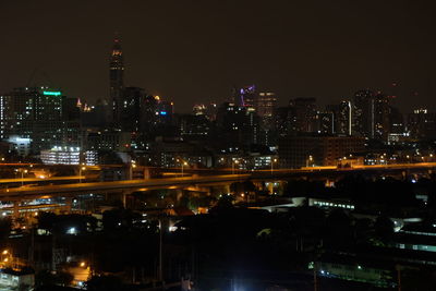 Illuminated buildings in city at night