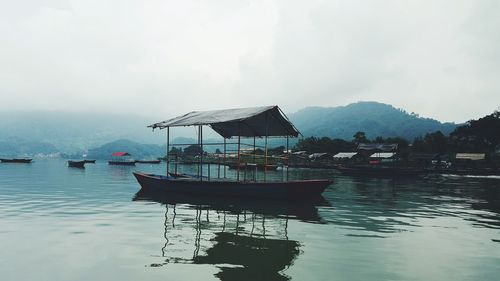 Scenic view of boats in lake