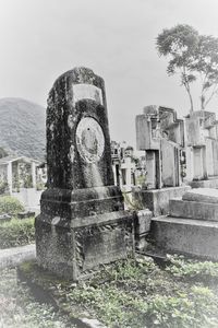 View of cemetery against built structure