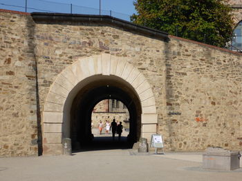 People at entrance of historic building