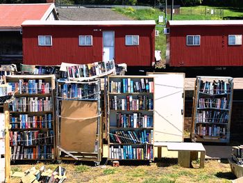 Stack of books on house against building