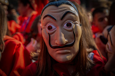 Close-up of woman wearing mask at event