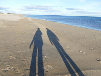 Shadow of people on beach