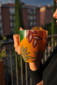 Close-up of hand holding painting