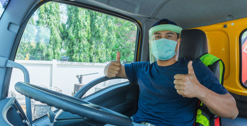 Man sitting in car