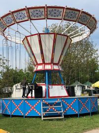 Ferris wheel in park against sky