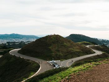 High angle view of road by mountain against sky