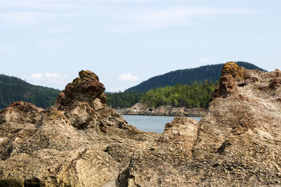 Scenic view of rock formations against sky