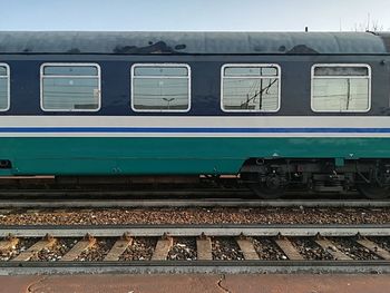 Train at railroad station against sky