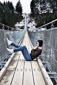 Young woman on a bridge