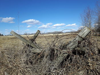 Abandoned field against sky