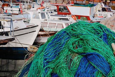 View of fishing net next to boats