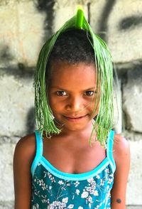 Portrait of cute girl standing outdoors