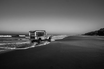 Scenic view of beach against clear sky