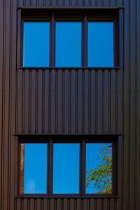 Low angle view of glass window of building