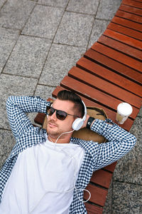 Full length of young man relaxing on floor