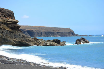 Scenic view of sea against clear sky