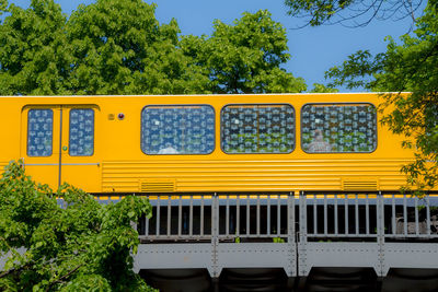 Yellow train on bridge