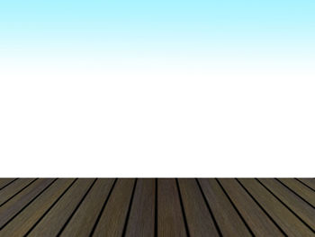 Full frame shot of wooden floor against clear sky