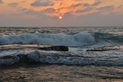 Scenic view of sea against sky during sunset