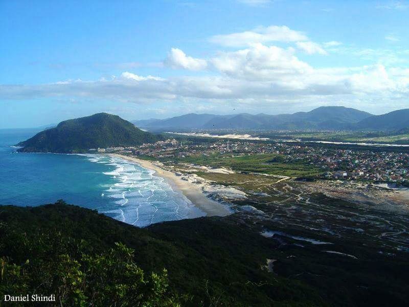 AERIAL VIEW OF LANDSCAPE AND MOUNTAINS AGAINST SKY