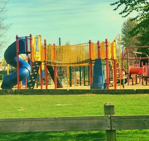 View of playground in park against sky