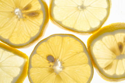 Close-up of lemon slice against white background