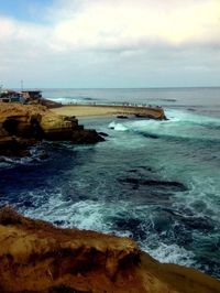 Scenic view of sea against cloudy sky