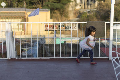 Girl walking in balcony