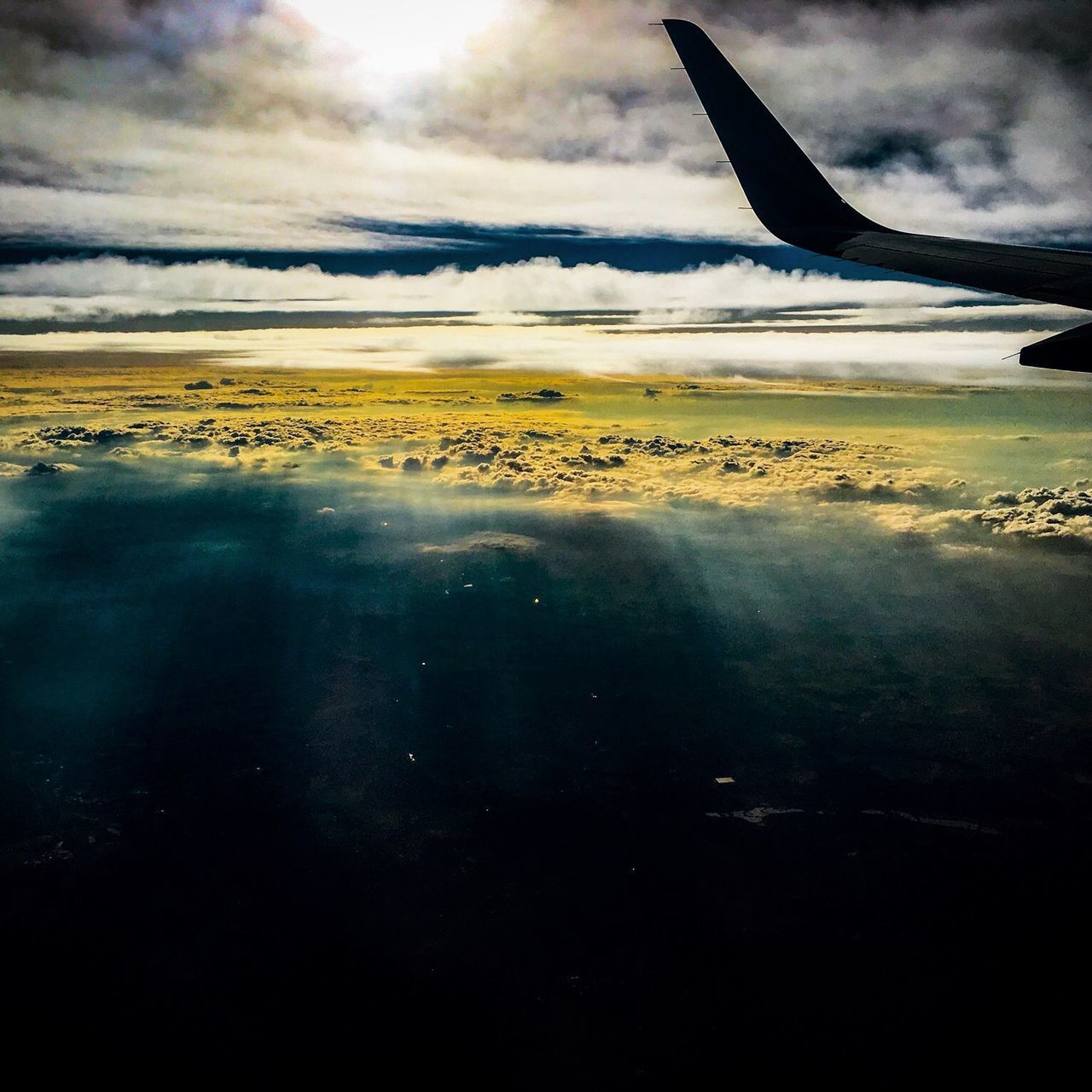 AIRPLANE FLYING OVER WATER