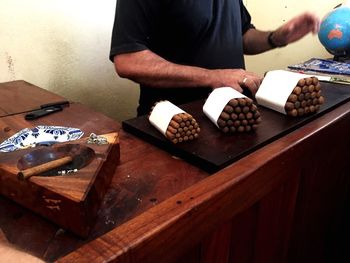 Midsection of man preparing food