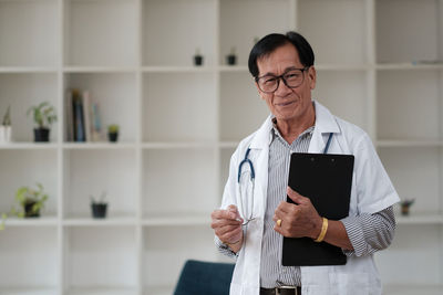 Young man using digital tablet in office