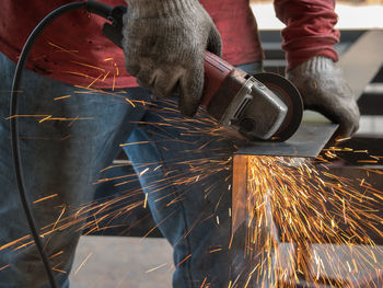 Man working on metal structure in factory