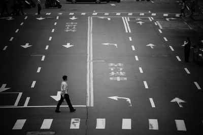 High angle view of man walking on road