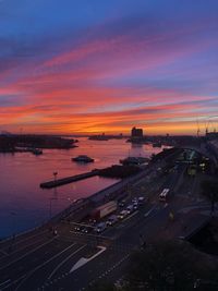 High angle view of road by river against sky during sunset