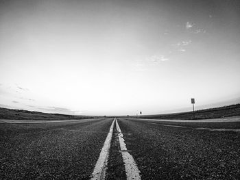 Empty road along landscape